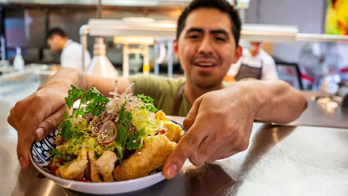 Taqueria owner behind the counter